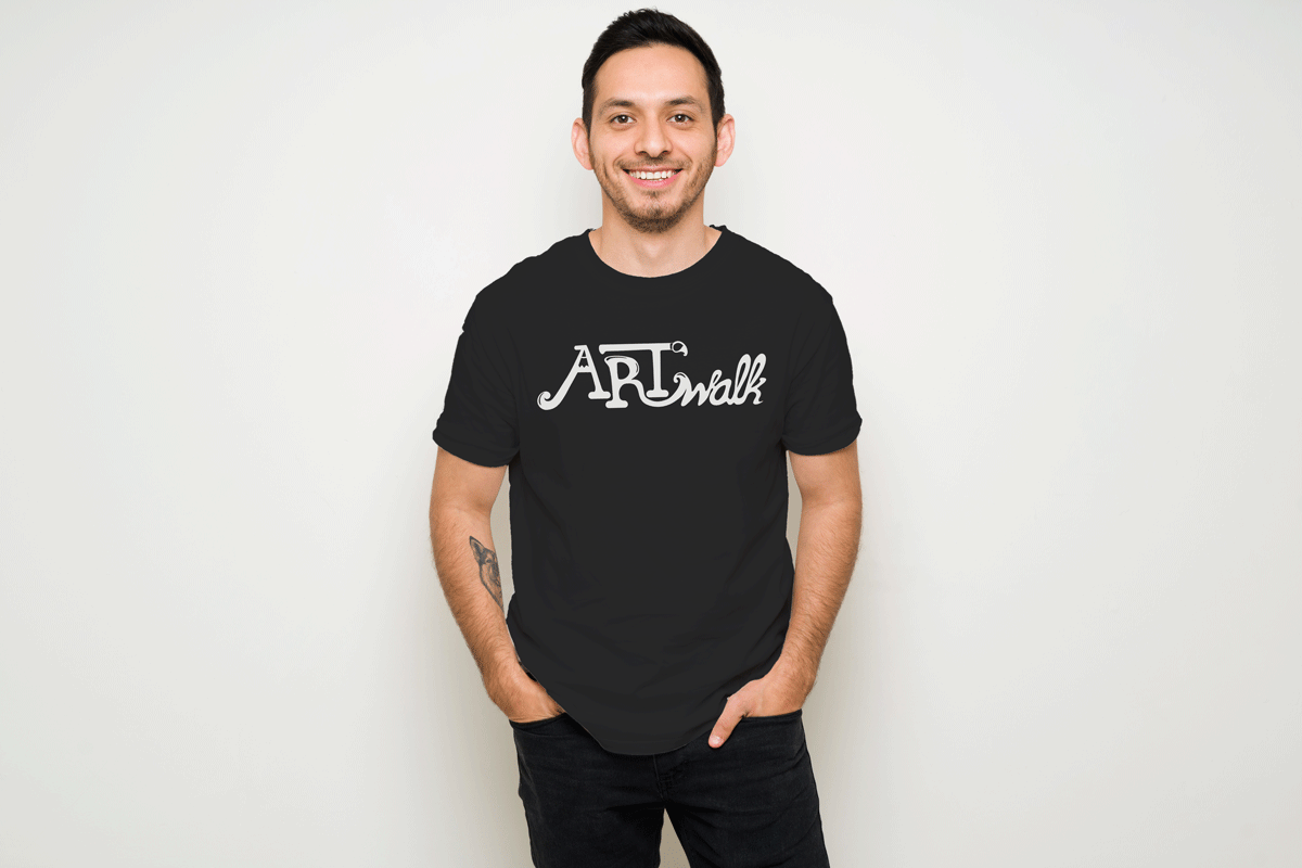 a man wearing a black tshirt with a white ArtWalk logo across the chest